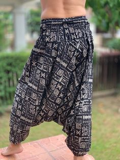 "⬇️ SHOP HERE https://www.etsy.com/ch-en/shop/IndycraftsDesigns Aladdin Pants, Harem Pants 100% Cotton Unisex pants, perfect for yoga, The pants have smock waist (wide bang elastic) The fabric is cotton soft, lightweight, and airy, ideal for those warm days. If it's a bit chilly, you could always wear leggings underneath. super comfortable cotton pants made of light, comfortable to wear cotton. The ideal pants for leisure, sport and wherever it should be loose and comfortable *Special features: Bohemian Baggy Pants With Tapered Leg, Bohemian Style Black Straight Pants, Cotton Trousers For Festivals, Cotton Festival Trousers, Bohemian Bottoms With Elastic Waistband And Tapered Leg, Bohemian Tapered Leg Bottoms With Elastic Waistband, Traditional Trousers For Festival, Traditional Festival Trousers, Traditional Ankle-length Bottoms With Elastic Waistband