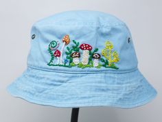 Item: mushroom embroidered bucket hat Material: 100% cotton Size: one size fits most Embroidery: hand made with acrylic thread Free first class shipping, upgradable priority mail service. 30 days return policy, feel confident at your purchase! Whimsical Cotton Cap, Whimsical Cotton Hats For Spring, Cotton Bucket Hat With Curved Brim For Festivals, Blue Cotton Bucket Hat For Festivals, Curved Brim Cotton Sun Hat For Festivals, Cotton Curved Brim Sun Hat For Festivals, Festival Cotton Sun Hat With Curved Brim, Cotton Festival Sun Hat With Curved Brim, Cotton Festival Hat, One Size Fits Most