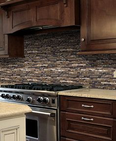 a stove top oven sitting inside of a kitchen next to wooden cupboards and counter tops