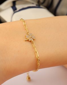 Add a touch of luck and elegance to your wrist with our 14K Gold Clover Bracelet. This dainty four-leaf clover bangle is the perfect lucky charm jewelry for her. Crafted with care and attention to detail, this bracelet features a delicate clover charm symbolizing good fortune and prosperity. Made from high-quality 14K gold, this bracelet exudes a luxurious and timeless beauty. It's designed to be both delicate and durable, making it suitable for everyday wear. Whether it's worn on its own or paired with other bracelets, this lucky charm jewelry adds a touch of sophistication to any outfit. This bracelet also makes a thoughtful gift for someone special. The four-leaf clover is a universal symbol of luck and good fortune, making it a meaningful present for birthdays, anniversaries, or any sp Elegant Good Luck Bracelet Jewelry, Elegant Good Luck Jewelry Bracelet, Meaningful Gold Bracelet, Delicate Bracelet Gold, Bracelets Christmas, Delicate Gold Bracelet, Clay Accessories, Lucky Leaf, Clover Jewelry