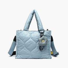 Loyalty bb tote: Cute, functional, & versatile as a crossbody. Puffy design with a quirky charm—daisy or egg? Features bottle holder & carabiner. Nylon Puffer Tote Bag, Puffy Design, Daisy Charm, Blue Puffer, Winter Neutral, Quilted Tote Bags, Quilted Totes, Chic Bags, Purse Accessories