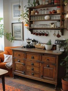 a coffee bar in the corner of a living room with potted plants on shelves