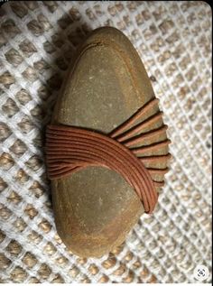 a close up of a rock with a knot on it