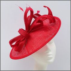 Elegant design disc fascinator/hatinator in red sinamay. Decorated with matching loops of sinamay and feathers. Made on a headband. Ideal for a wedding, Ladies day, race day or other special occasions. This design is available in other colours on request. All of our designs can be made to order in a range of different colours or styles, see our colour chart: https://jacquivaledesigns.co.uk/pages/sinamay-colour-chart Please contact us if you would like a bespoke design to match your outfit. We ma Green Fascinator, Wedding Fascinators, Feather Fascinators, Derby Day, Grand National, Royal Ascot, Elegant Red, Headpiece Wedding, Bespoke Design