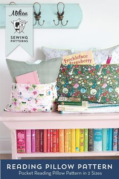 a book shelf with books and pillows on it