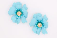 Make your fashion statement with these unique blue flower earrings. Crafted with precision and attention to detail, these earrings are sure to bring out your unique style and make you stand out from the crowd. An ideal accessory for any ensemble, these earrings will be sure to upgrade your fashion outlook. Care: To restore the luster and shine of your jewelry, use a jewelry cloth or soft cotton cloth to gently buff the piece. Size and Fit: 1.8 inches Blue Flower Earrings, Petal Earrings, Designer Party Dresses, Sustainable Fashion Brands, Romper With Skirt, Sweater Set, Heeled Loafers, Blue Flower, Jean Leggings