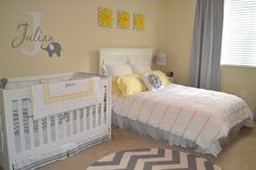 a baby's room with yellow and gray decor