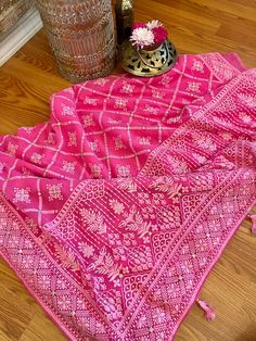 A very very pretty Chikankari saree in pure georgette in a lovely candy pink shade with all over jaal (barfi pattern) embroidery with mukaish work (embellishments). The pallu is short but features intricate designs. The entire saree has the same pattern from the very beginning of the saree except the portion you have to tuck in so that it doesn't bulge. Entire saree is framed in cord piping, best quality satin falls are attached and picot stitching is done as well. The blouse piece is separated Pink Semi-stitched Saree With Intricate Embroidery, Pink Dupatta With Intricate Embroidery, Pink Dupatta With Intricate Embroidery In Traditional Drape, Pink Dupatta With Intricate Embroidery For Diwali, Traditional Pink Saree With Intricate Embroidery, Pink Traditional Wear With Intricate Embroidery For Ceremonies, Pink Zari Work Dupatta For Traditional Ceremonies, Pink Dupatta With Zari Work For Traditional Ceremonies, Pink Bollywood Traditional Wear With Chikankari Embroidery