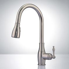 a kitchen sink faucet with chrome finish