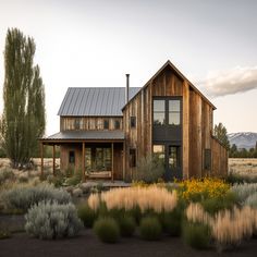 a wooden house in the middle of a field