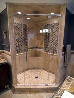 a walk in shower sitting inside of a bathroom