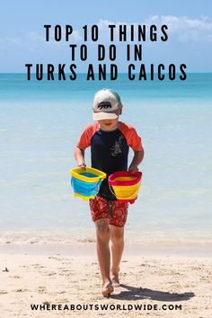 a young boy carrying two buckets on the beach with text overlay that reads top 10 things to do in tuks and caios