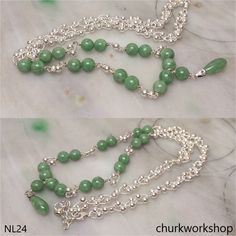 Jade beads sterling silver necklace.•Color: Green •Rain drop size: 17 mm•Thickness: 7 mm•Bead size: 7.6 - 7.9 mm•Setting: Sterling silver•Weight: 28.4 grams•Translucency: Opaque •Length: Chain 20 and extended chain 1 1/2 inches •Code: NL24Symbolizes: Good luck, protection, longevityThis handcrafted jade pendant is guaranteed to be 100% natural, non-enhanced, and untreated.•We do our best to keep the photos the same as the item; these photos are not enhanced or edited. Please keep in mind that the color may vary on different monitors.•Should you find that this piece does not meet your expectations, we do accept returns within 7 days of receiving the product. However you must notify us within 24 hours of receiving the item. For more details on our Payment and/or Return policy, please visit t Elegant Silver Jade Beaded Necklace, Handmade Silver Jade Beaded Necklace, Silver Gemstone Beaded Necklaces, Silver Jade Beaded Necklaces As Gift, Silver Jade Beaded Necklace As Gift, Jade Bangle, Jade Ring, Jade Bracelet, Jade Stone