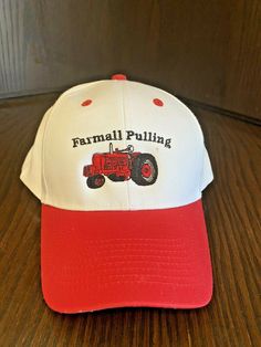 Very nice NOS vintage 6 panel tractor hat custom embroidered Farmall Tractor and Farmall Pulling. One size fit most. adjustable snap on the back. The cap is white and red in color.  This custom embroidered hat was done by a local business in Ohio. Red Cotton Trucker Baseball Cap, Red Cotton Trucker Hat, Tractor Hat, Custom Embroidered Hats, Farmall Tractors, Hat Custom, Embroidered Hat, Embroidered Hats, Local Business