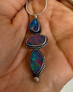 Breathtakingly beautiful trio of large, high grade rainbow fire Australian Boulder Opals.  Genuine, natural diamond accent.  Solid 925 sterling silver.  2 inches long  Artisan/Silversmithed in California.  18 inch snake chain. Rainbow Fire, Australian Boulder Opal, Gorgeous Bracelet, Australian Opal, Opal Necklace, Boulder Opal, Opal Rings, Snake Chain, Sterling Silber