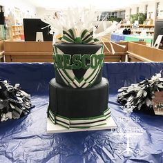 there is a cake that has been decorated with green and white stripes