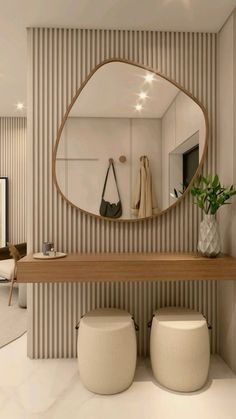 there is a mirror and stools in the room with striped wallpaper on the walls