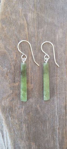 Wyoming Jade Earrings. Lovely cloudy apple green color. Very translucent and lightweight. I used .925 solid sterling for the ear wires and jump rings. All of our jade is handcarved and polished. There may be imperfections in the shape and polish. We leave a slightly matte finish on most pieces. This gives them a very natural and smudge free look.  Thank you for visiting our listing! Green Jade Earrings For Pierced Ears, Green Minimalist Pierced Earrings, Minimalist Green Pierced Earrings, Green Minimalist Sterling Silver Earrings, Minimalist Green Sterling Silver Earrings, Green Minimalist Dangle Earrings, Green Jade Nickel-free Earrings, Nickel-free Green Jade Earrings, Green Nickel-free Jade Earrings