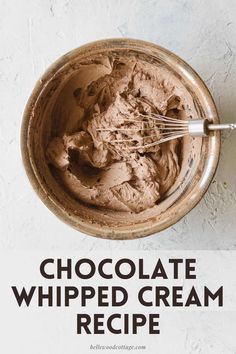 chocolate whipped cream in a bowl with a whisk sticking out of the top