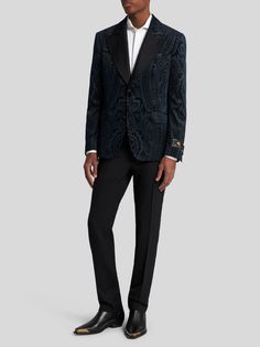 Cotton velvet evening blazer, decorated with a metallic placed paisley print, reconstructed all over. This model is embellished with a tailored label, hand-stitched onto the cuff. It features a contrasting paisley undercollar and a lining embellished with a tone-on-tone floral striped design.• Regular fit• Silk canneté peak lapels• Single-breasted closure with jewelled buttons• Welt breast pocket• Side flap pockets• Cuffs with jewelled buttons• Rear vent• Made in Italy• The model is 6’2” (188 cm) tall and wears a size 48 (IT)
• 100% cotton• Lining: 100% viscose Poncho Jacket, Best Wallet, Suit Shirts, Fragrance Collection, Socks And Tights, Cotton Velvet, Tie And Pocket Square, Newborn Outfits, Clothes Gift