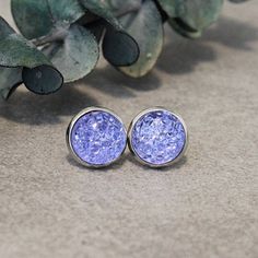 Made of shimmering resin, these lavender druzy earrings add a punch of sparkle to your outfit! * Size: 10mm (medium) druzy  * Includes soft silicone backings, AND stainless steel backings! * Metal settings are stainless steel posts (hypoallergenic and gentle on sensitive skin or clip-on. * For hygiene reasons, no returns on earrings OPTIONAL ACCESSORIES: Matching accessories available! Please see last picture for examples (black shown as sample only, product color will match listing) At check-ou Light Purple Earrings, Purple Earring, Hell Lila, Bridesmaid Earring, Dark Blue Earrings, Lavender Necklace, Lavender Bridesmaid, Lavender Earrings, Large Stud Earrings