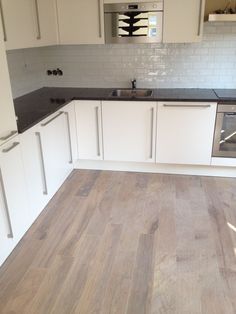 the kitchen is clean and ready for us to use it's new flooring