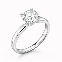 a white gold engagement ring with a round diamond