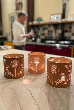 My scotch thistle lantern - oak, maple,walnut - size medium in my kitchen, Jim in the background Outlander Decor, Scottish Home Decor, Thistle Art, Scottish Decor, Artificial Candles, Thistles Art, Outlander Gifts, Scottish Homes, Thistle Design