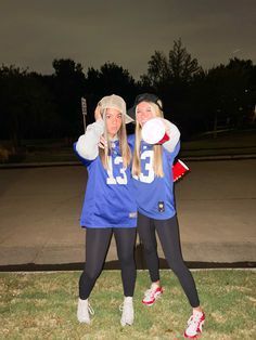 two women in blue jerseys posing for a photo