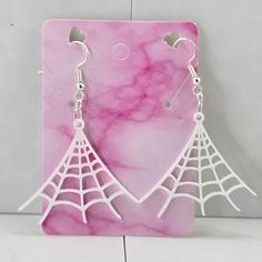 Spider web earrings!- 3d printed earrings! These earrings are designed and printed by me and my family. Made with hypoallergenic 925 plated silver hooks. Super lightweight earrings, weighing in at 0.1 oz Be sure to check out our other earrings! https://erraticandeccentric.etsy.com White Laser Cut Earrings As A Gift, White Laser Cut Earrings For Gift, White Laser-cut Jewelry For Gifts, Spider Web Earrings, 3d Printed Earrings, Printed Earrings, Me And My Family, Lightweight Earrings, Light Weight Earrings