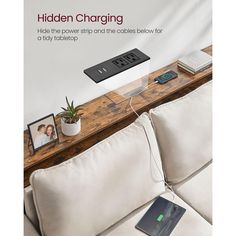 an advertisement for the hidden charging device on a couch with pictures and a plant in it