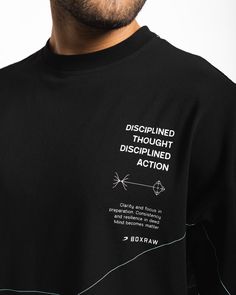 In life, you only have mastery over your thoughts and actions. Through disciplined thought and disciplined action, you begin to foster growth by aligning a focused mindset with purposeful execution. This stretch cotton oversized tee is constructed to provide you with optimal airflow as the rounds build up. Featuring Disciplined Thought, Disciplined Action text and icons, complemented with the golden ratio construction of the Strike Logo, this shirt serves as a reminder to the process we must fol Quotes Shirt Design, Text T Shirt Designs, Tee Shirt Designs Graphics, Tshirt Text Design, Tshirts Design Ideas, Black Tshirt Design, Logo Shirt Design, Black T Shirt Design