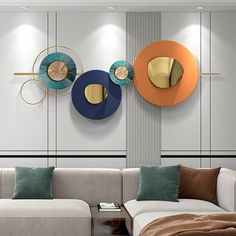 a living room with two couches and three circular mirrors on the wall