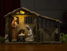 a nativity scene with figurines of jesus and mary