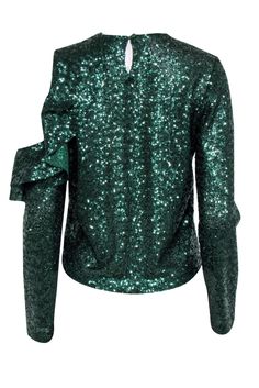 You can't get anymore festive that a green sequins top for the holidays! So go ahead and grab this holiday party-ready top from Miss Anouki! Rock this with a tulle skirt or keep it more casual with a pair of your favorite jeans. Either way you flaunt this, Santa will definitely count you on his nice list! Size S/M Made in the US Fabric content unavailable Round neckline Single button closure at back neck Long sleeves Bust 40" Waist 36" Shoulder to hem 21" Glamorous Christmas Sequin Tops, Christmas Sequin Tops, Glamorous Contrast Sequin Tops For Holidays, Glamorous Holiday Tops With Contrast Sequin, Glamorous Christmas Tops For Night Out, Glamorous Green Evening Tops, Glamorous Green Top For Evening, Glamorous Festive Tops With Contrast Sequin, Glamorous Green Tops For Evening