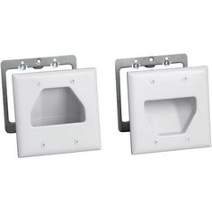 two white square recessed lighting covers with brackets on each side and one facing the viewer