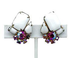 "Vintage Juliana Mid Century Milk Glass Pink Aurora Borealis Rhinestone Earrings Up for offer is a stunning pair of vintage mid century Juliana white milk glass and pink aurora borealis paste rhinestone clip on earrings. Earrings are not marked. Measurements Length: 1.25\" Width: 0.90\" Weight: 15.4 g Condition: Very good; item is pre-owned and has some signs of use. Please look closely at the pictures provided as they are an extension of our written description. 4192C E 4Z" White Costume Jewelry Earrings For Party, Vintage White Glass Jewelry, White Crystal Clip-on Earrings For Party, Pink Aurora Borealis, Vintage Lucite Jewelry, Pink Aurora, Vintage Enamel Clip-on Earrings For Evening, Vintage Enamel Clip-on Earrings, Vintage Gold Enamel Clip-on Earrings