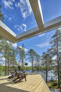 a wooden deck with picnic tables on it