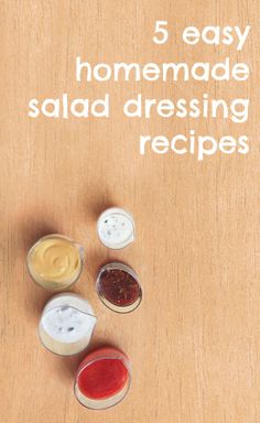 five homemade salad dressing recipes on a wooden table