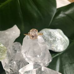 a ring sitting on top of some crystal stones