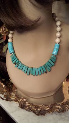 "One strand beaded necklace made with faceted natural jade, turquoise flat beads and turquoise teardrops. The center drop measures about 1\" long and the beige jade is 12mm. This beautiful necklace measures 18\" long. Looks great with lots of outfits. If you like it \" pin it \" or share on Facebook." Cheap Turquoise Double Strand Necklace, Turquoise Amazonite Beaded Necklace, Adjustable Turquoise Jade Beaded Necklace, Turquoise Beaded Jade Necklace, Turquoise Gemstone Beads Necklace In Jade, Turquoise Jade Necklace With Gemstone Beads, Hand-strung Turquoise Jade Beaded Necklaces, Hand-strung Turquoise Jade Beaded Necklace, Turquoise Jade Hand-strung Beaded Necklace