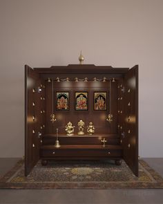 a wooden shrine with three buddhas in it