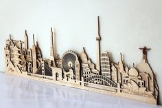 a wooden cutout of a city skyline