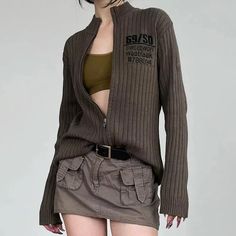 Channel the grunge era with this zip-up cardigan jacket. Its slim fit, combined with a unique gray-brown color, makes it a standout piece for streetwear enthusiasts. Crafted with long sleeves and a comfortable fit, it's perfect for adding an edge to any casual outfit. Grunge aesthetic Long sleeve Gray brown color Zip front fastening SIZE (cm) BUST LENGTH SLEEVE LENGTH S 80 53 64 M 84 55 65 L 88 57 66 SIZE (inch) BUST LENGTH SLEEVE LENGTH S 31.5 20.9 25.2 M 33.1 21.7 25.6 L 34.6 22.4 26 Aesthetic Long Sleeve, Moda Grunge, Grunge Aesthetics, The 90s Fashion, Slim Cardigan, Jeans Grunge, Hip Hop Fashion 90s, 90s Y2k Fashion, Fall Outfits Y2k