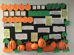 a bulletin board decorated with pumpkins and writing on it's sides for good study