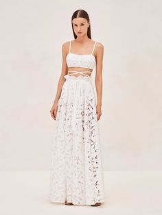 The Dilara Skirt offers a versatile and romantic flair with its detailed lace craftsmanship. Designed to be worn with or without its accompanying slip, it allows for customizable styling – choose full coverage or a hint of allure. It's perfect for pairing with the Riva Top for a seamless ensemble White Maxi Skirt, White Maxi Skirts, Party Pants, Skirt Jumpsuit, White Maxi, Lace Design, White Skirts, Classy Outfits, Jacket Tops