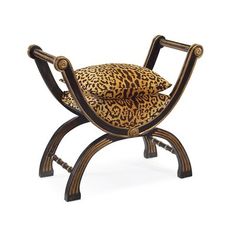 a chair with a leopard print cushion on it's back and legs, sitting in front of a white background