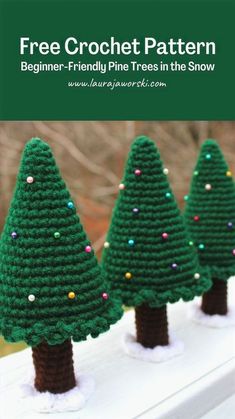 three crocheted christmas trees sitting on top of a white fence with text overlay that says free crochet pattern beginner - friendly pine trees in the snow