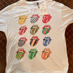 a white t - shirt with the rolling stones on it