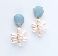 Pearl Flower Blue Earrings, Blue Jade, Something Blue, Bridesmaid Soft Blue Earrings, Bridesmaid Gift, All Occasion Light Blue Earring White Pearls form a flower and dangle from your choice of Jade posts.  Pictured here is the Light Blue Jade. These would make a perfect Bridesmaids gift or to wear to all the festivities and beyond that special day. They are a great versatile pair of earrings. The total earring measures approximately 1.5 inches. Color Chart:  First row - White Jade, Crystal Quart Bride With Blue Earrings, Blue And Pearl Earrings, Something Blue Jewelry, Something Blue Earrings, Blue Wedding Earrings, Light Blue Jewelry, Blue Earrings Wedding, Wedding Earrings Pearl, Light Blue Earrings